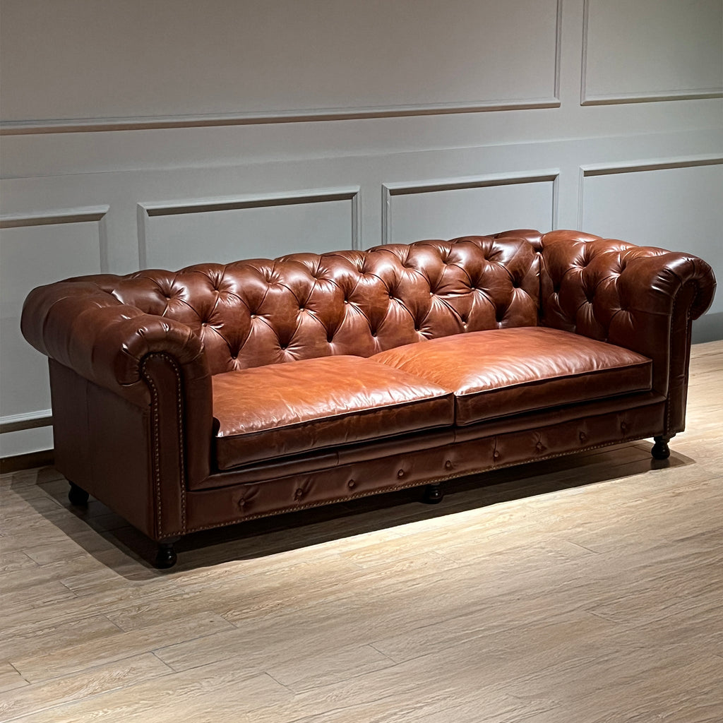 Canapé Chesterfield en cuir capitonné