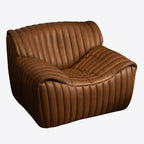 Fauteuil en cuir capitonné