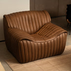 Fauteuil en cuir capitonné